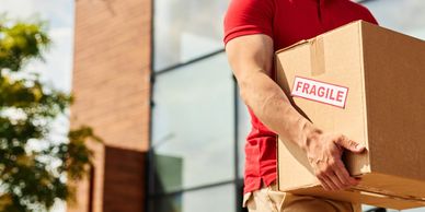 A box being carried into a business.