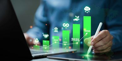 Person using a digital pen with a green rising graph overlay about sustainability.