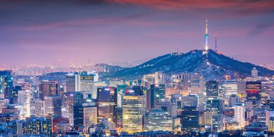Seoul, South Korea cityscape at dusk showing the hill in the background