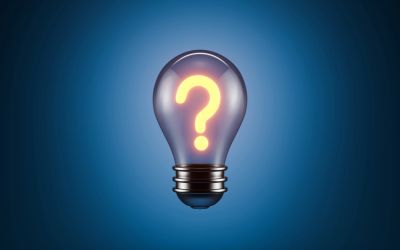 Light bulb with glowing question mark inside.