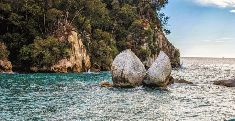 The Moeraki Boulders are unusually large spherical boulders lying along a stretch of Koekohe Beach on the wave-cut Otago coast of New Zealand between Moeraki and Hampden.