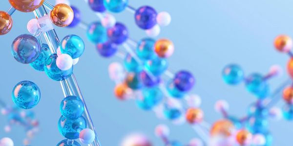 Colorful molecular structure model with blue, orange, and white spheres.