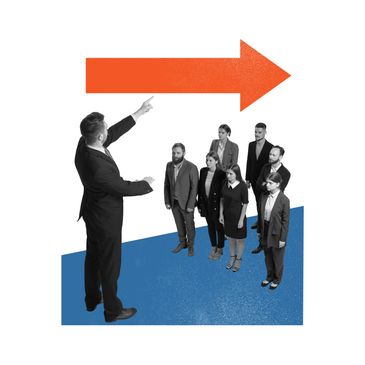 A man points right, leading a group of businesspeople.