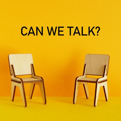 Two chairs facing each other, as if ready for a conversation