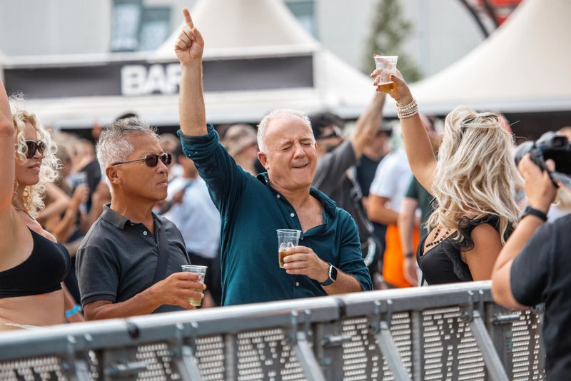 Four beautiful diverse senior friends enjoying downtime together at a daytime dance event