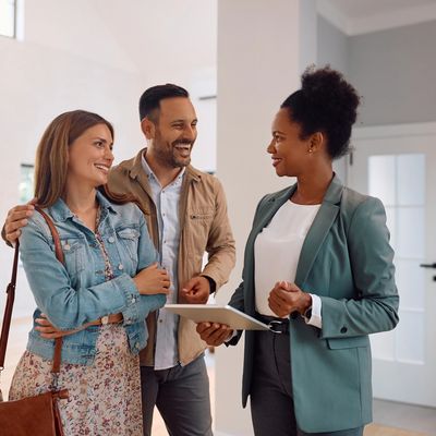 Realtor showing a family a possible home to purchase. 