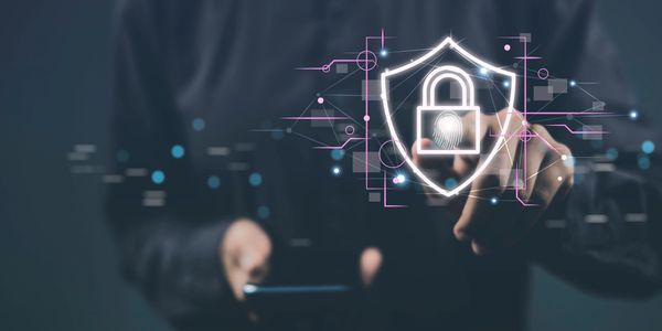 Person interacting with a digital lock security interface on a transparent screen.
cybersecurity services
