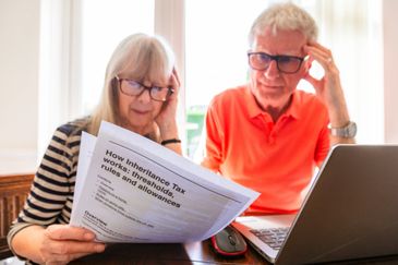 Elderly couple reviewing inheritance tax rules and allowances.