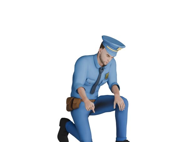 Police officer kneeling and pointing downward.