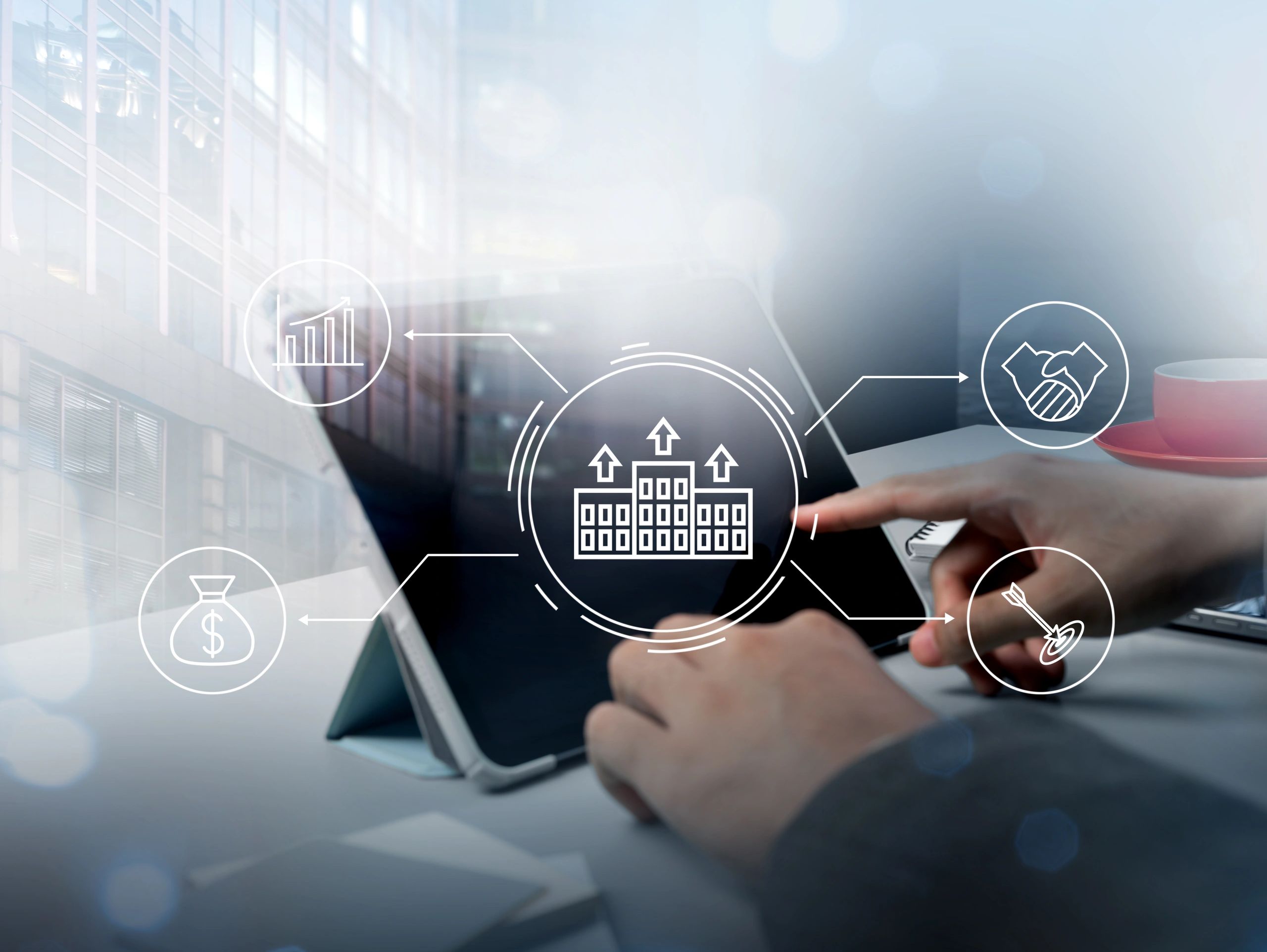 Person using tablet with business growth icons overlay.