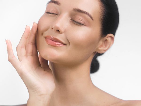 Woman using skincare products