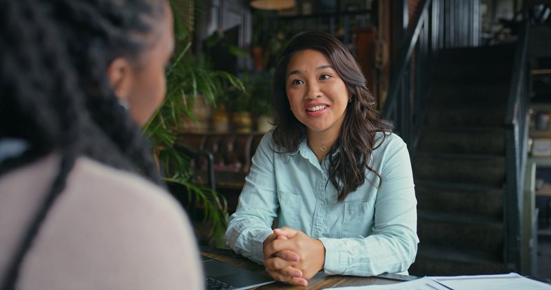 Woman, cleint and financial advisor with advice for consulting, discussion and talking for investment plan. People, meeting and accountant speaking of taxes paperwork, legal help and loan feedback