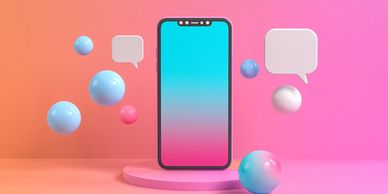 Smartphone with gradient screen surrounded by colorful floating spheres and speech bubbles.