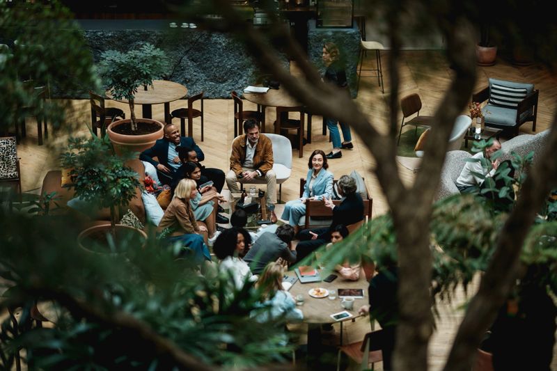 Colleagues having a coffee break in a modern office building in Paris, France