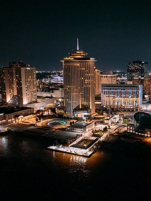New Orleans nighttime skyline overlooking convention district, major hub for corporate events.