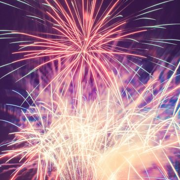 Colorful fireworks bursting in the night sky.