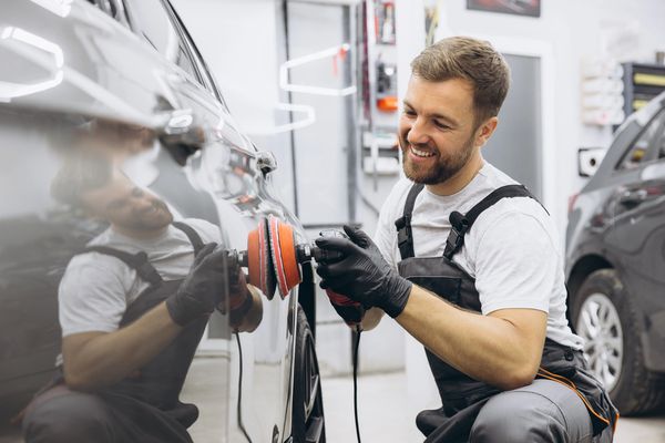 Expert polishes car high-quality detailing
