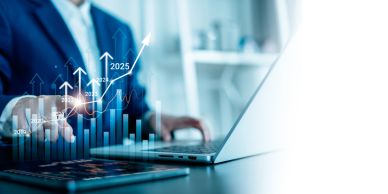Person analyzing financial growth charts on laptop.