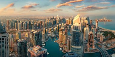 Dubai, UAE skyline at dusk, taken from the air.