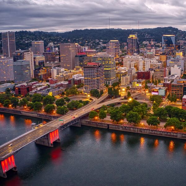 Portland skyline and bridges at sunset overlooking the Willamette River.
