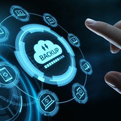 Hand interacting with a digital backup interface surrounded by connected device icons.