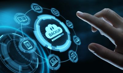 Hand interacting with a futuristic digital backup interface.