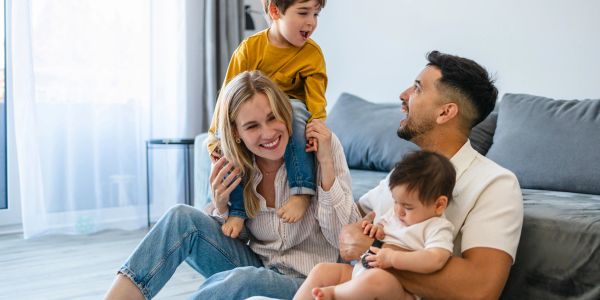 Happy family playing together at home.