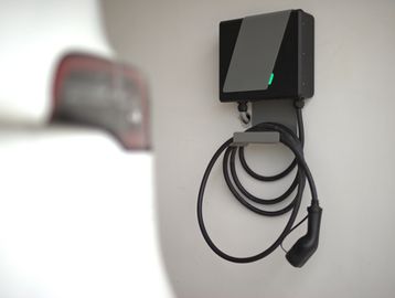 Electric car charger mounted on a wall.