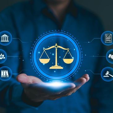 Hand holding digital justice scale with legal icons in blue.