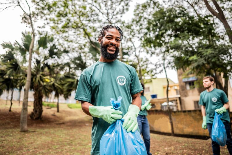 Portrait of a young man cleaning a public park