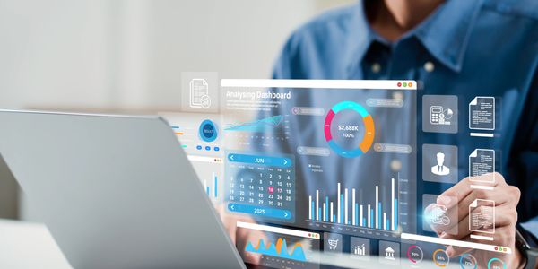 A professional financial consultant discussing strategies with clients, with charts, graphs, and documents on the table. The background reflects growth and stability with icons of finance, capital, and investment. The scene represents trust, clarity, and personalized financial solutions—showing how NextUnity Capital Solutions helps individuals and businesses plan budgeting, loans, investments, and capital management with confidence.