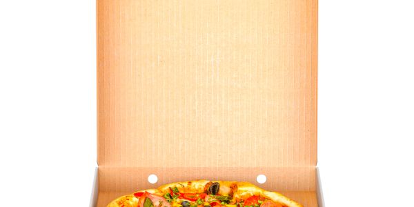 Fresh vegetable pizza in an open cardboard box.