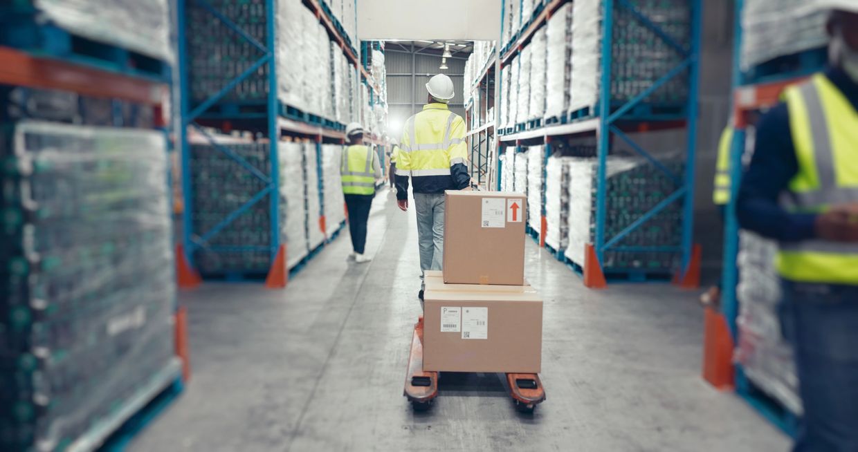 A man store the parcel inside the warehouse