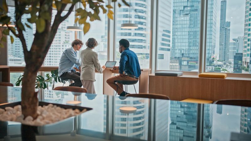 Multiracial businesspeople are talking and discussing business development in a modern office.