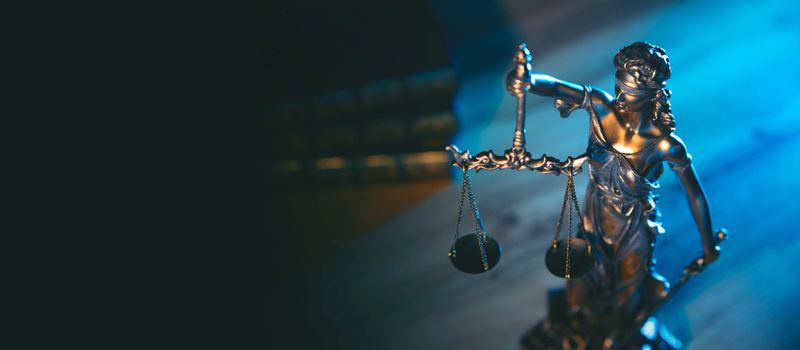 Lady justice. Statue of Justice in library. Legal and law background concept