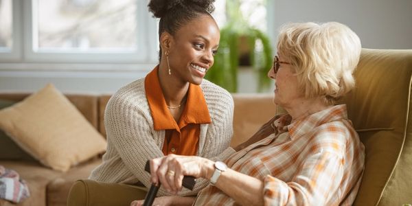 Allegro Concierge Care nurse chatting with elderly patient