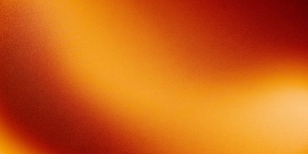 Abstract gradient background with warm orange and red tones.