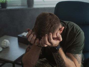 overwhelmed man. Traumatic thoughts. 