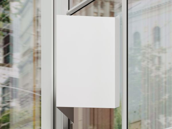 Blank white sign on a glass door with city reflections.