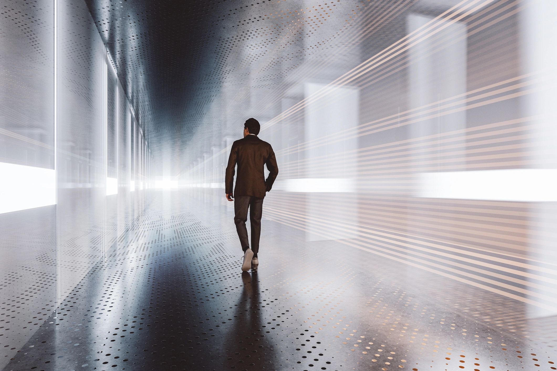 Man in suit walks through futuristic lit corridor with reflections.