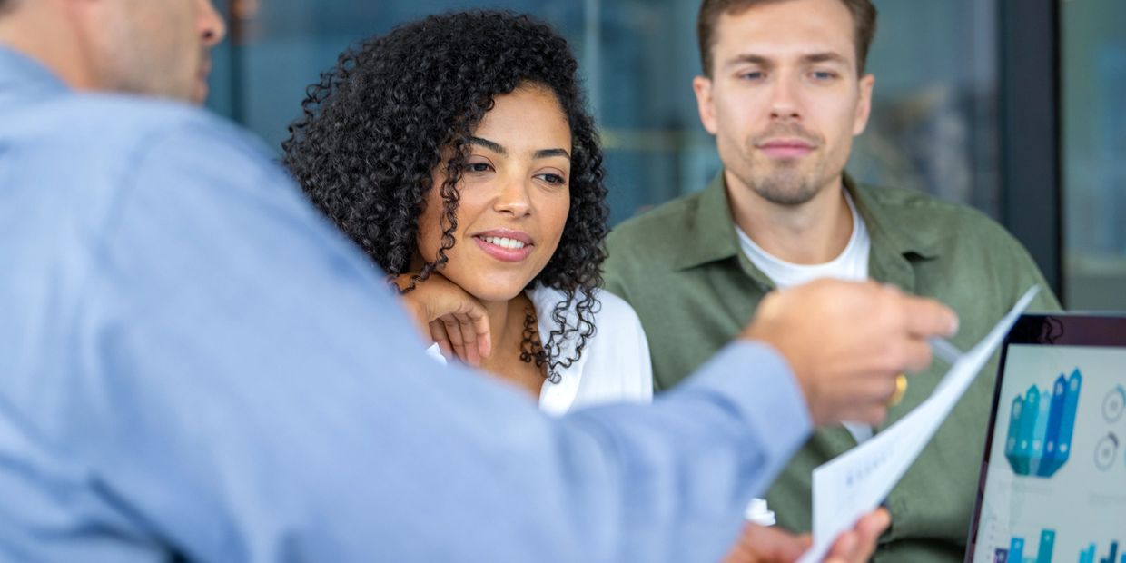 Home claim insurance adjuster helpin home owners go over their policy