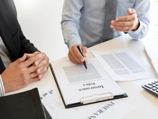 Reviewing insurance policy contract coverage.
