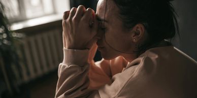 A woman feeling sad, or maybe constipated. 