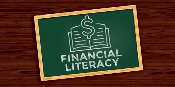 Chalkboard with a financial literacy message and dollar sign.