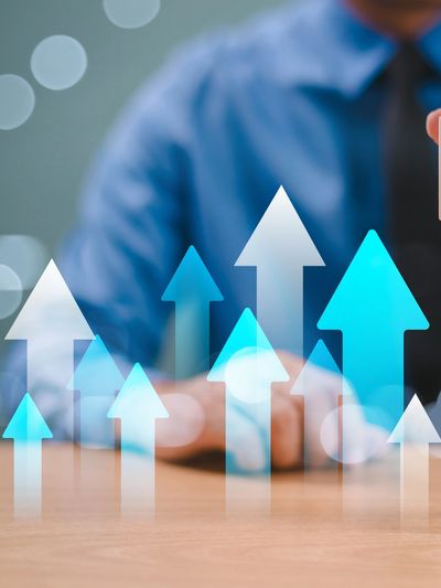 A wooden block with arrows pointing up and down.