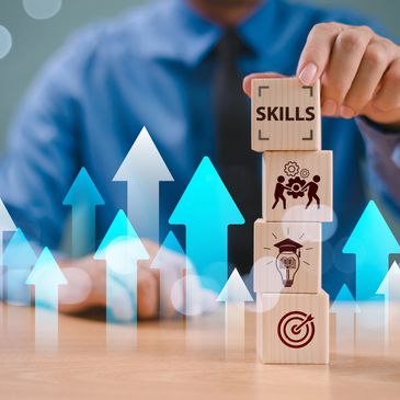 Businessman stacking blocks labeled with skills and growth icons.