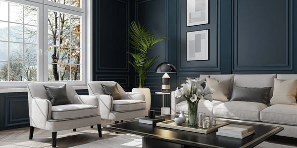 Elegant living room with dark blue walls, white furniture, and large windows.