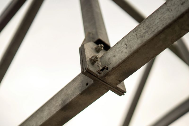 large metal profile channels connected by bolted joints, highlighting industrial strength and structural integrity in modern construction techniques