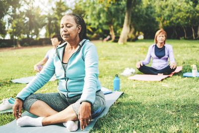 Meditation group in park