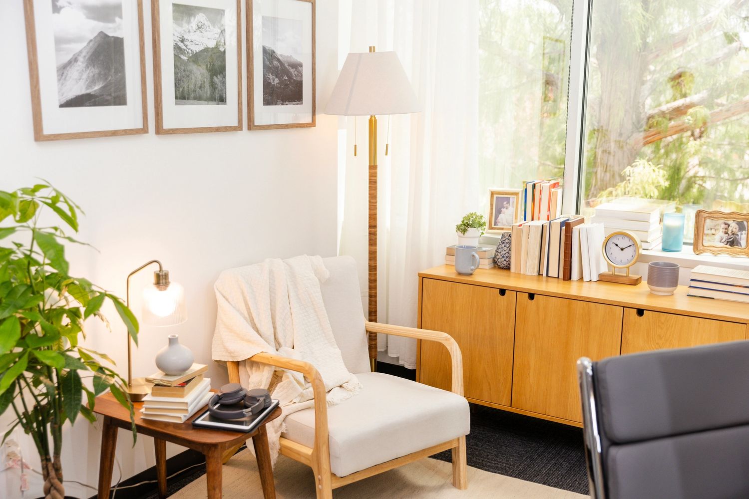 Two women engaged in a friendly conversation in a bright office.